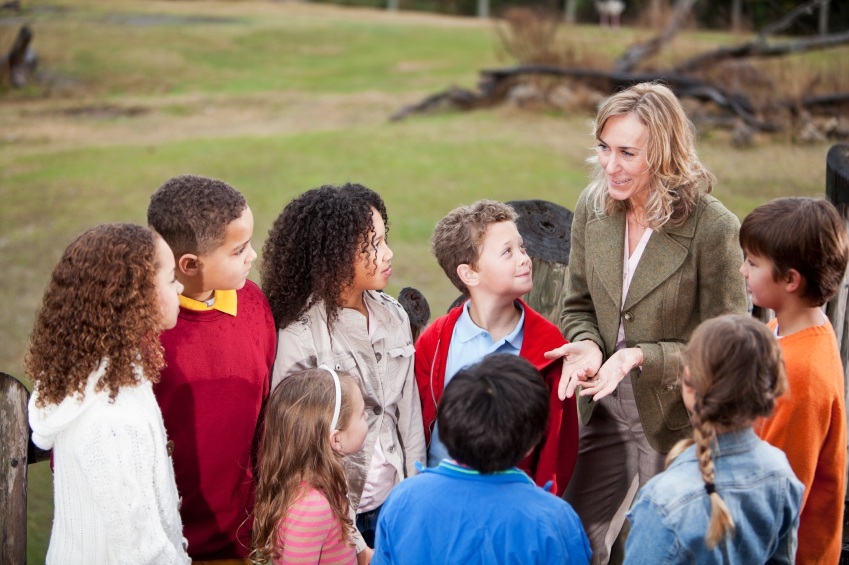 educators at a zoo with children